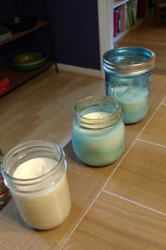Three lard candles in a row.