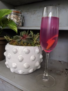 Alcoholic drink called the Violet 75.